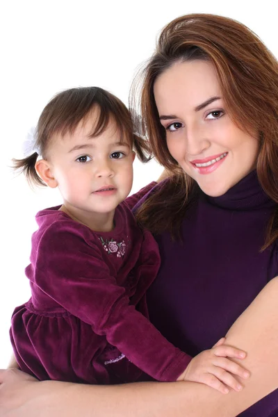 Smiling mother and daughter in violet — Stock Photo, Image