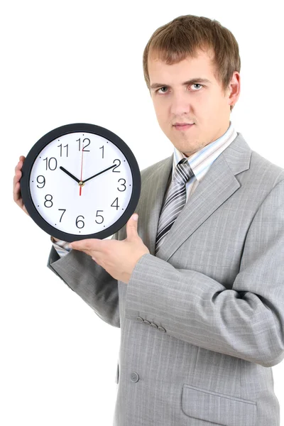 Молодий бізнесмен тримає годинник — стокове фото