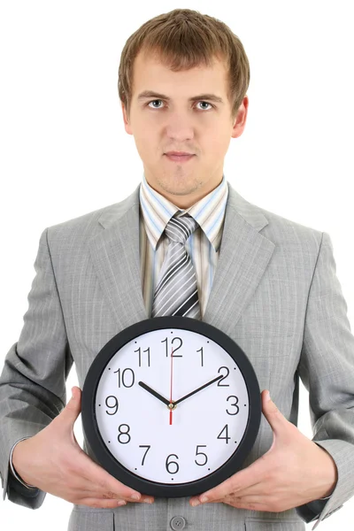Jovem empresário segurando um relógio — Fotografia de Stock