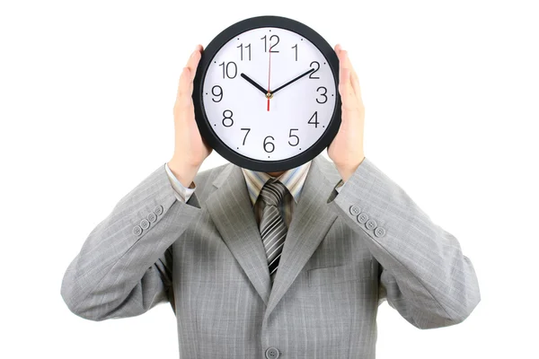 Man in gray suit holding big clock covering his face — Stock Photo, Image