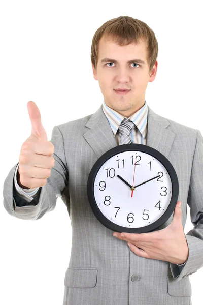 Młody biznesmen posiadania zegar — Zdjęcie stockowe