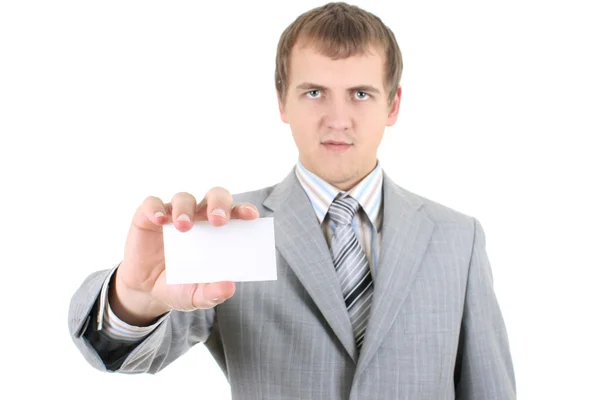 Jovem empresário mostrando um cartão de visita em branco — Fotografia de Stock