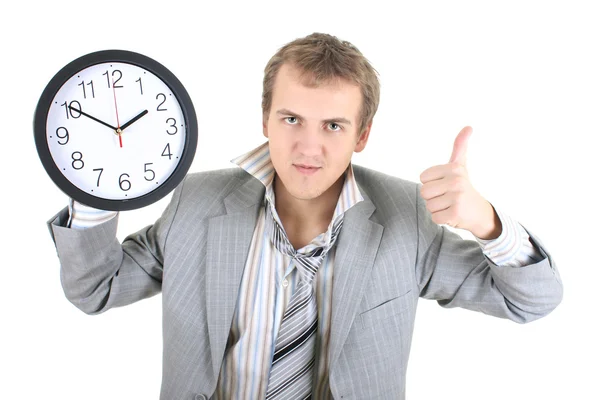 Happy businessman holding a clock — Stock Photo, Image