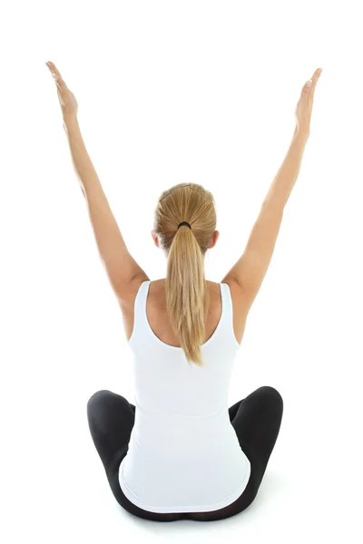 Жінка робить йогу на білому тлі — стокове фото