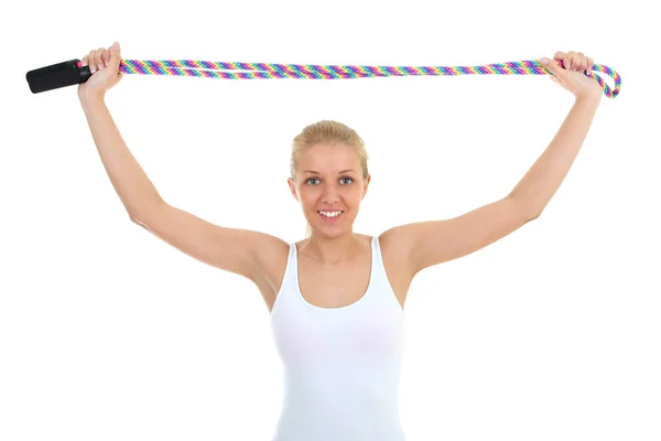Спортивна жінка з пропускаючою мотузкою ізольована над білим — стокове фото