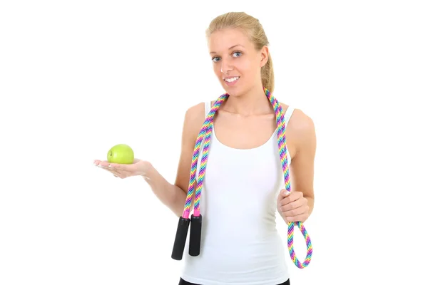 Girl with jump rope and apple — Stock Photo, Image
