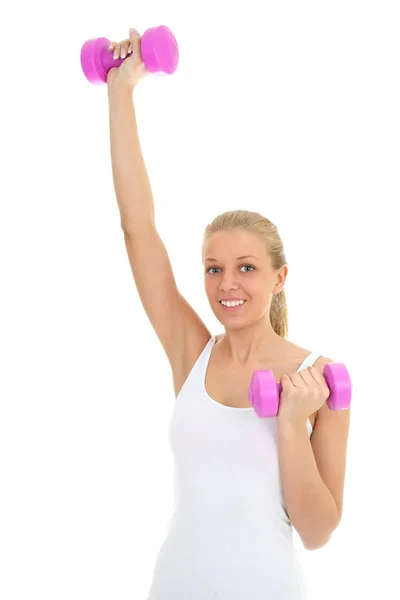Young woman with dumbbells over white — Stock Photo, Image