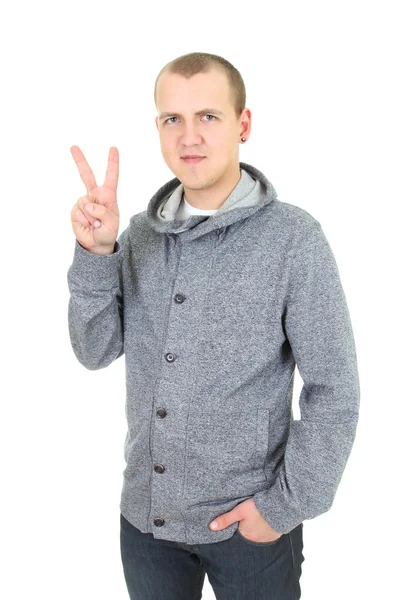 Casual young man showing a victory sign — Stock Photo, Image