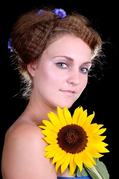 Frau mit Sonnenblume — Stockfoto