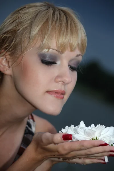 Portrait of blond woman with white flower — Stock Photo, Image