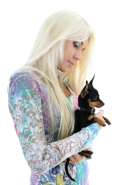Jonge vrouw met puppy in haar handen over Wit — Stockfoto