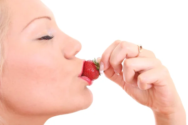 Woman with strawberry in her lips — Stock Photo, Image
