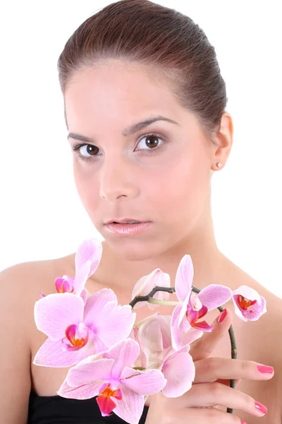 Junge schöne gesunde Frau mit Orchidee — Stockfoto