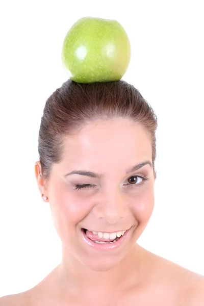 Gesunde Frau mit grünem Apfel winking — Stockfoto