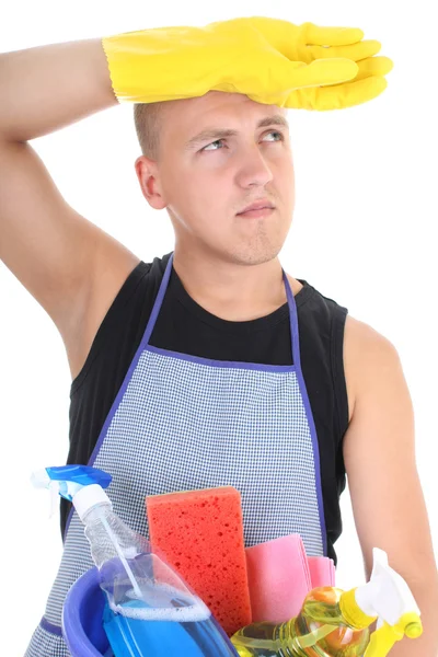 Tired man with cleaning supplies — Stock Photo, Image