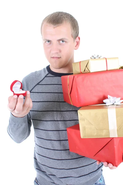 Young man holding gifts — Stok fotoğraf