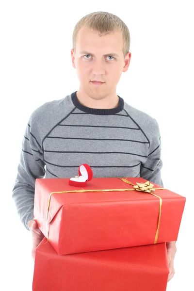 Young man holding gifts — Stock Photo, Image
