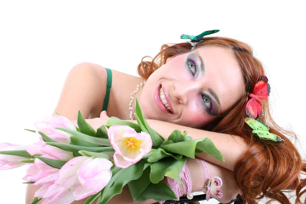 Red-haired woman with flowers and butterflies on her head — Stock Photo, Image