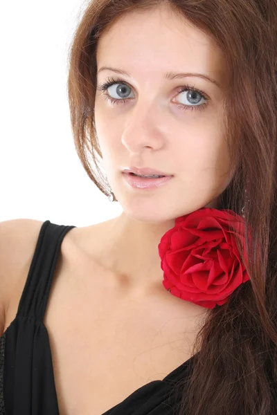 Retrato de menina com uma rosa vermelha no cabelo — Fotografia de Stock