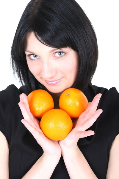 Jeune belle femme avec des oranges — Photo