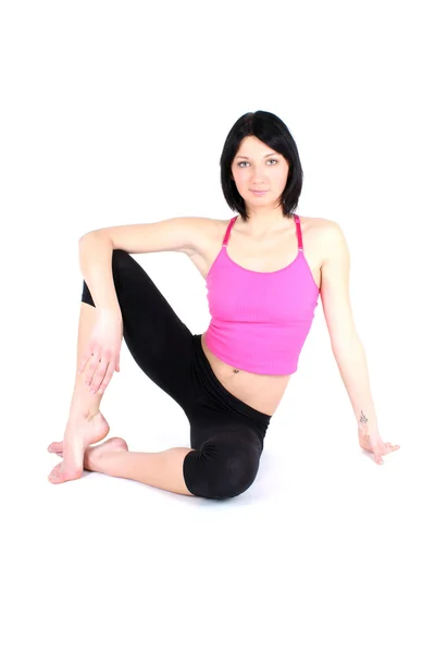 Yoga yaparken pembe kadın — Stok fotoğraf