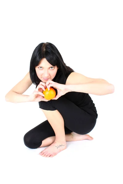 Chica posando en negro con naranja —  Fotos de Stock