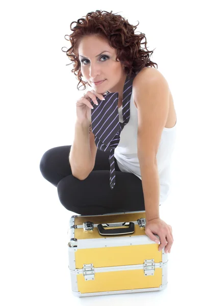 Atraente mulher sentada com caixa de ferramentas sobre branco — Fotografia de Stock