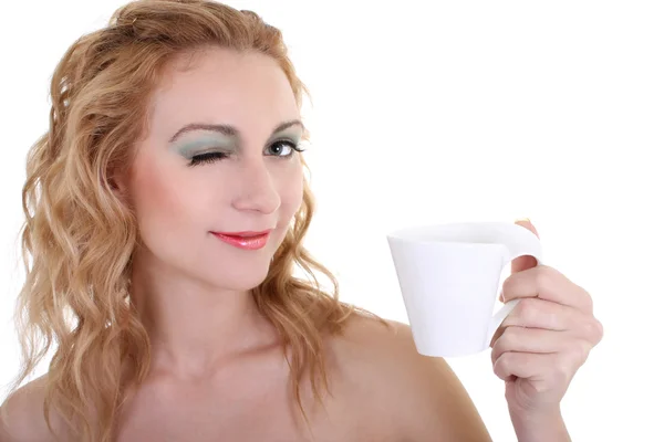 Young woman with mug of coffee over white — Stock Photo, Image
