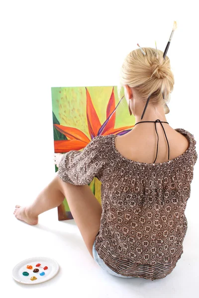 Woman painting a picture over white — Stock Photo, Image