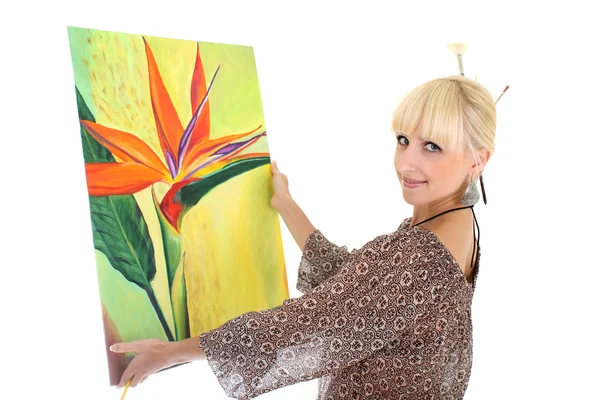 Woman painter showing her picture over white — Stock Photo, Image