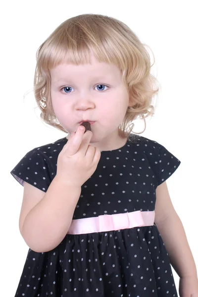 Little girl with chocolate candy — Stock Photo, Image