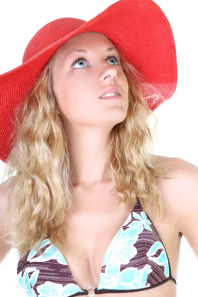 Happy young woman in swimsuit and red hat — Stock Photo, Image