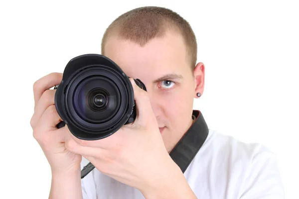 Man posing with a photographic camera Stock Image