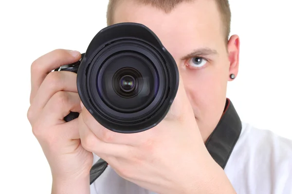 Young man holding camera Stock Photo