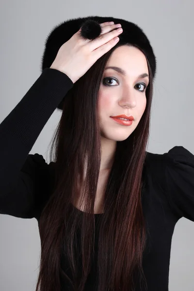 Happy woman in black fur hat — Stock Photo, Image