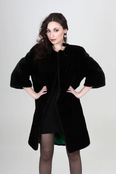 stock image Fashionable woman in black fur coat
