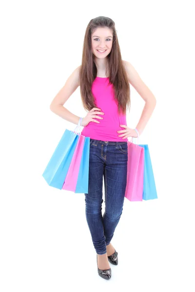Šťastné teenager v růžové tričko s nákupní tašky — Stock fotografie