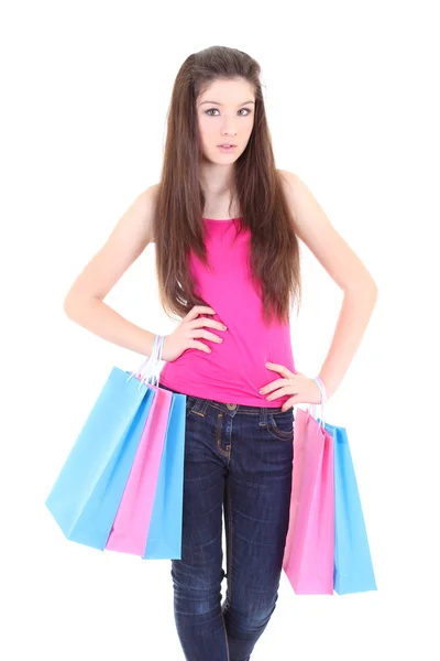 Adolescente em t-shirt rosa com sacos de compras — Fotografia de Stock