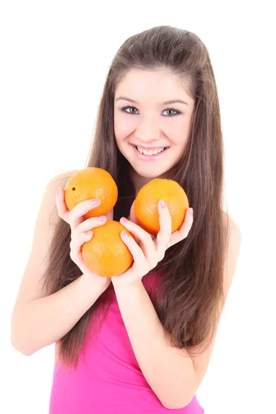 Счастливый подросток в розовом с апельсинами — стоковое фото