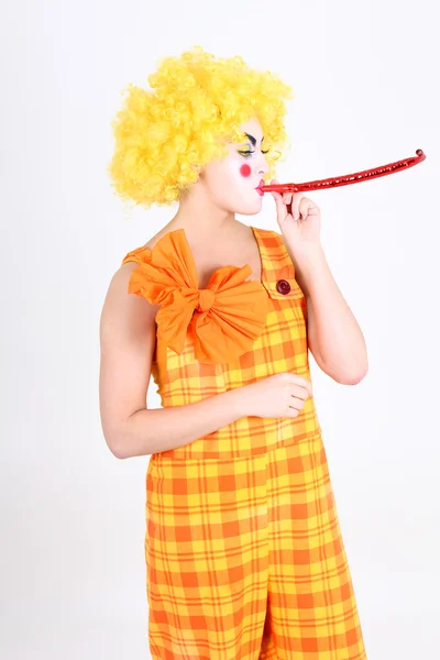 Funny clown in costume with whistle — Stock Photo, Image