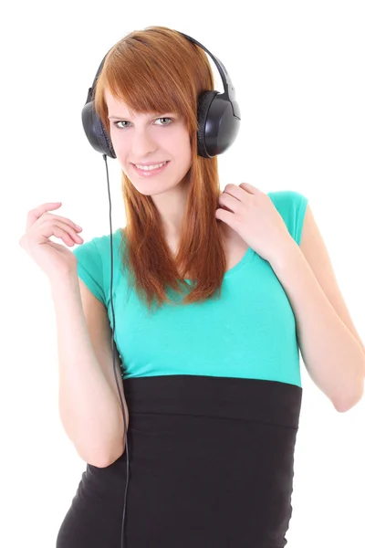 Lycklig tonåring med hörlurar i klänning — Stockfoto