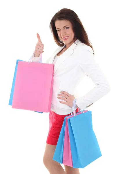 Žena s nákupní tašky ukazuje palec — Stock fotografie