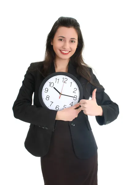 Empresária de terno segurando um relógio — Fotografia de Stock