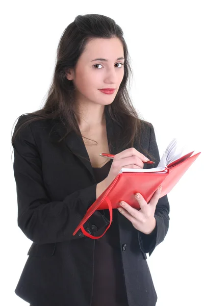 Γυναίκα των επιχειρήσεων γράφει σε ένα σημειωματάριο — Φωτογραφία Αρχείου