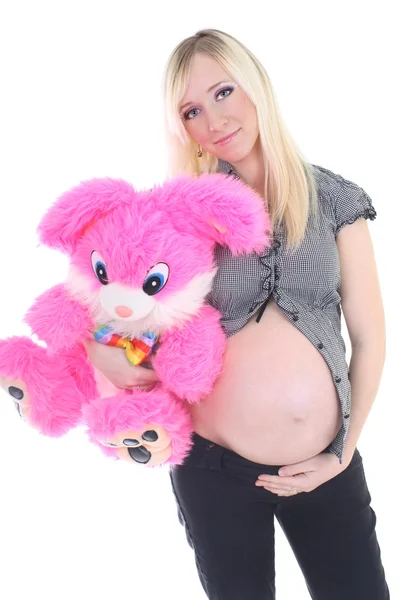 Jovem mulher grávida com brinquedo grande — Fotografia de Stock