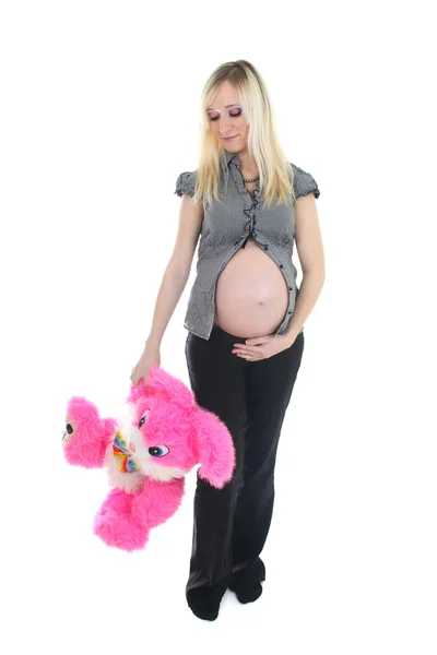 Jeune femme enceinte avec gros jouet — Photo