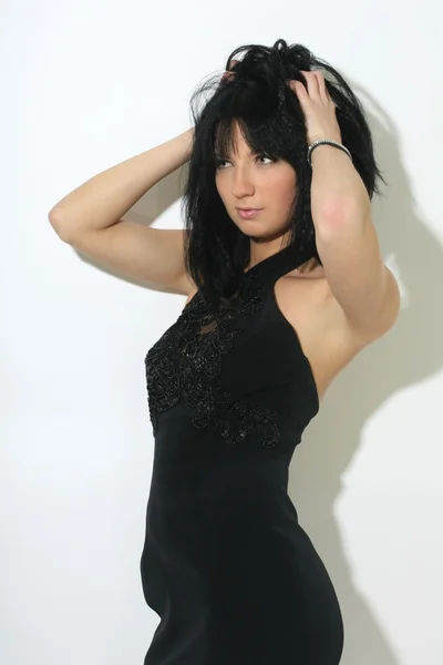Mooie vrouw in zwarte sexy jurk — Stockfoto