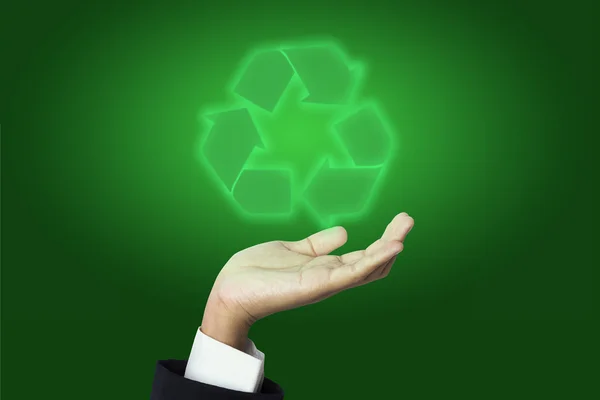 Бизнесмен держит знак Recycle — стоковое фото
