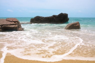 The waves breaking on a stony