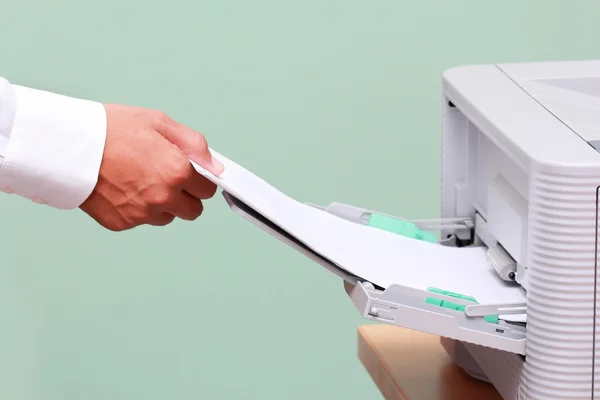 Businessman working with printer — Stock Photo, Image